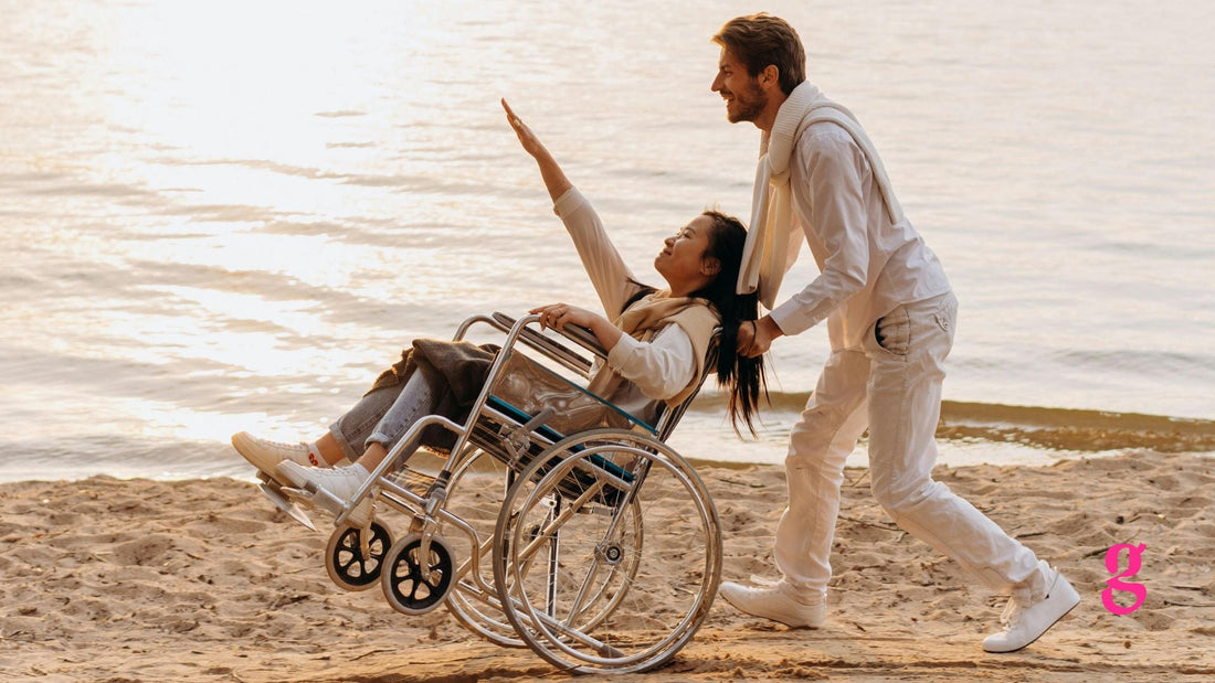 man pushing a woman in a wheelchair